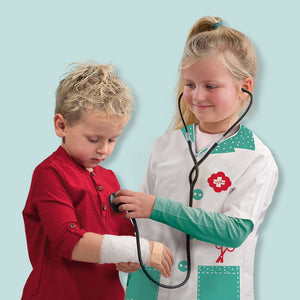 Child listening to a heartbeat with the SES Creative stethoscope
