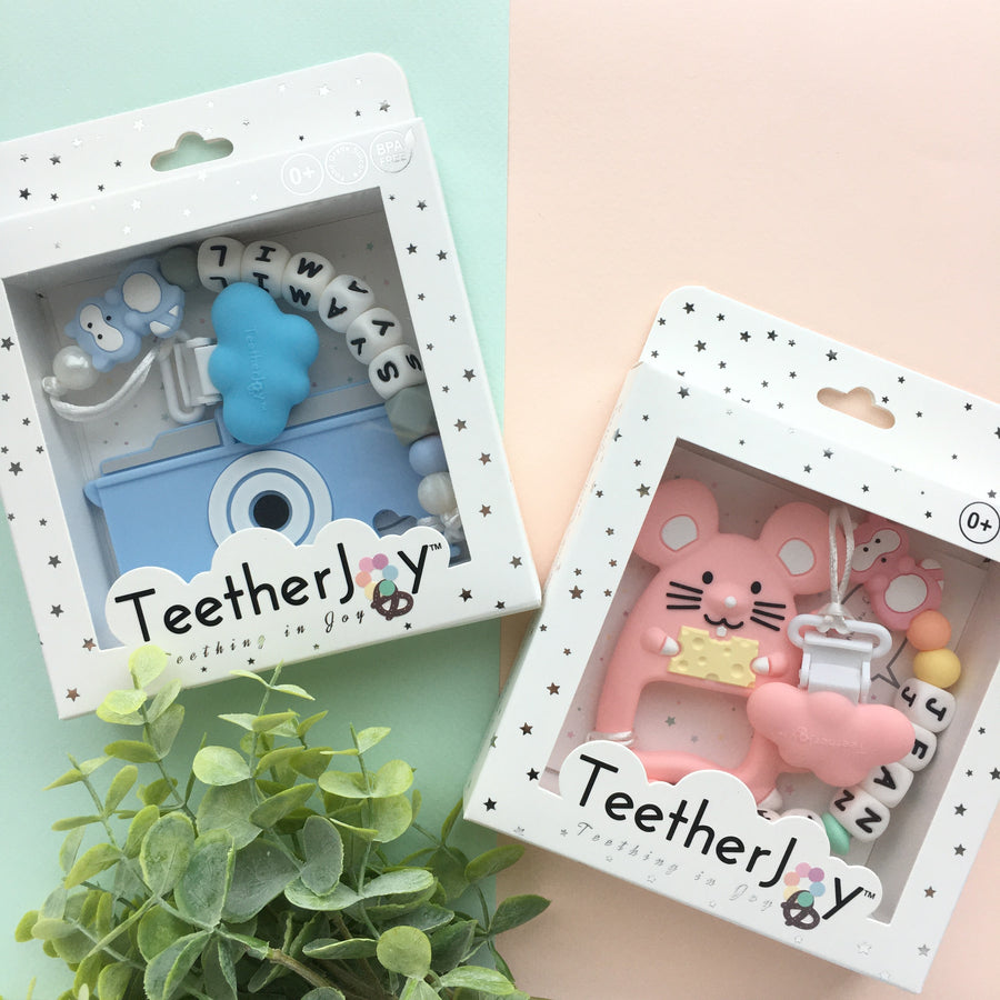 TeetherJoy pacifier clip with matching silicone teether, boxed