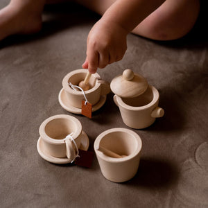 Child playing with the PlanToys Tea Set