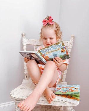 Child reading the Ditty Bird Potty Time Sounds book
