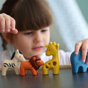 Child playing with the PlanToys Wild Animals Set