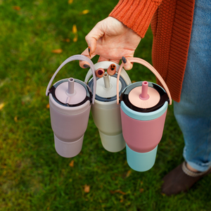 Carrying three BruMate Resa tumblers by their swing handles
