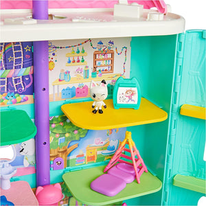 Close-up of the furniture and room backdrops inside the dollhouse