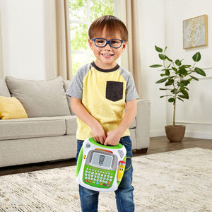 Child carrying LeapFrog Mr. Pencil's Scribble, Write & Read by its handle