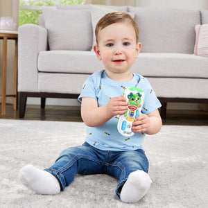 Baby holding the LeapFrog Channel Fun Learning Remote