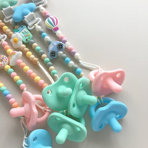 TeetherJoy pacifiers and assorted beaded pacifier clips