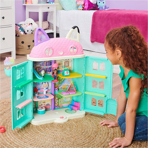 Child playing with Gabby's Purrfect Dollhouse