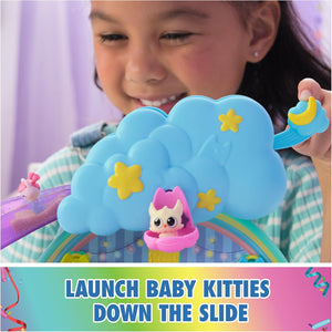 Launching a baby kitty down the glittery slide