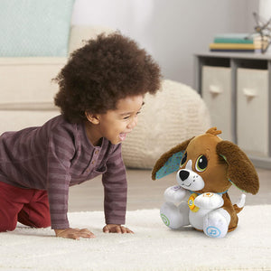 Child crawling towards the LeapFrog Speak & Learn Puppy