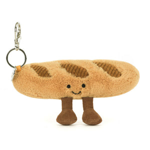 Jellycat Amuseables Baguette Bag Charm attached to a bag
