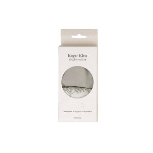 Baby wearing the Kays+Kins Woodland print bandana bib