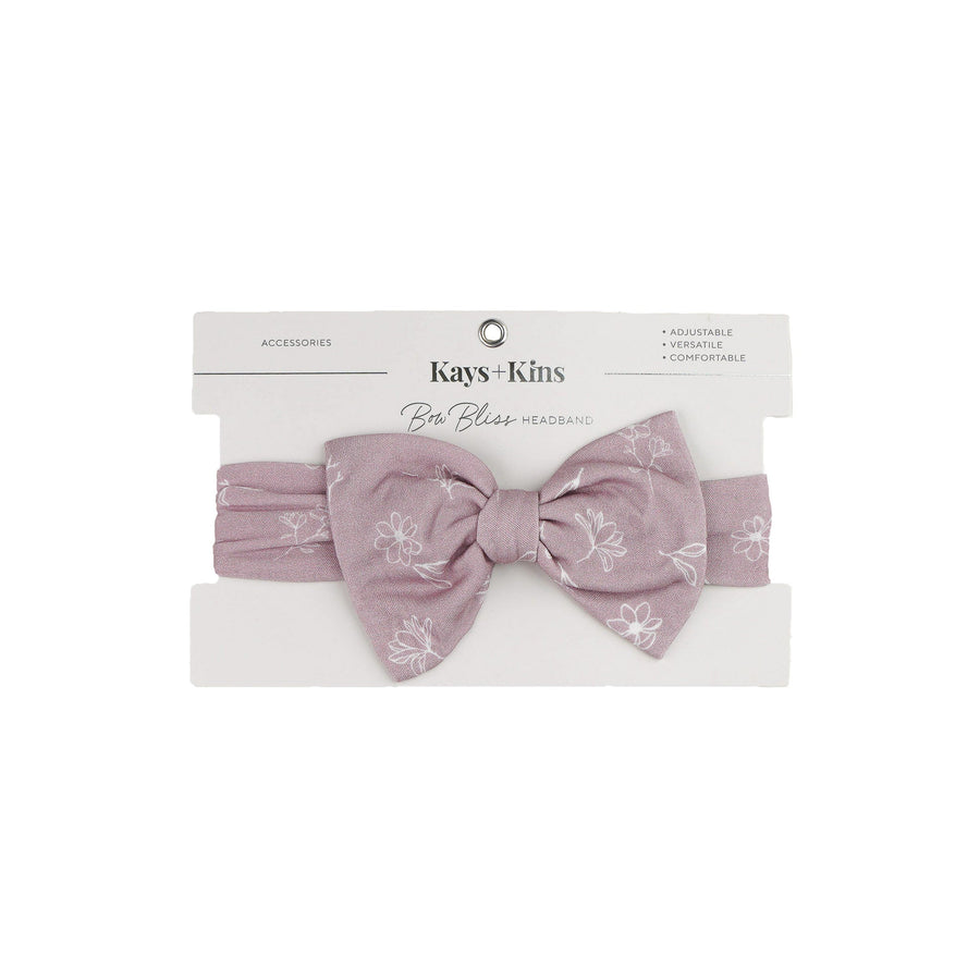 Kays+Kins Bowbliss headband in Veloura, mauve with a white floral print, on brand card