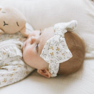Detail of the Kays+Kins Wildflower Haze print bow headband