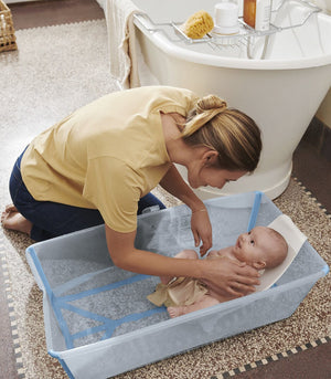 Baby being bathed in Stokke Flexi Bath X-Large Ocean Blue