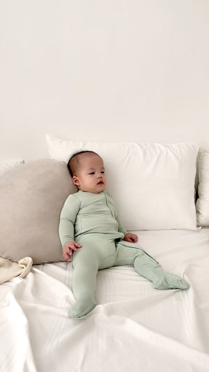 Baby wearing Number Twelve Bamboo Footies in Pistachio