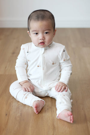Baby wearing Twinkle Planet Sailor Blue organic cotton onepiece
