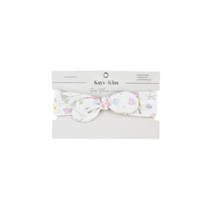 Baby wearing the Kays+Kins Sea Bloom print pre-tied bow headband