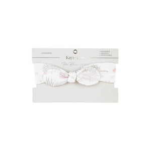 Baby wearing the Kays+Kins Seahorse Cove print pre-tied bow headband