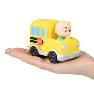 Cocomelon mini school bus held in a hand, for scale