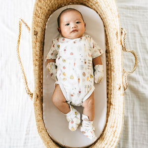 Baby wearing the KAYS + KINS Veggie Patch kimono one piece