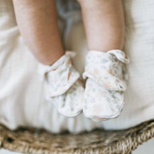 Baby wearing Kays+Kins Petalyn print booties