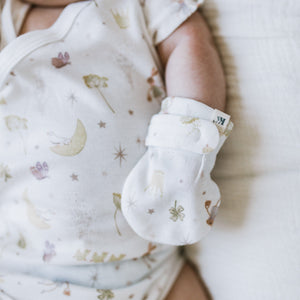 Baby wearing Kays+Kins Twinklebelle print mitts