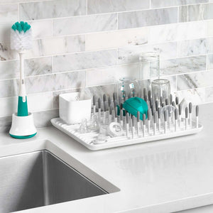OXO Tot bottle brush and stand on a kitchen counter