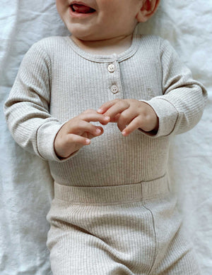 Purebaby Rib Long Sleeve Henley Bodysuit - Biscuit Melange worn