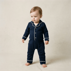 Baby wearing the Count & Countess Urban Navy Pima romper sleepsuit