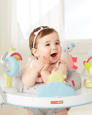 Baby playing in the Skip Hop Silver Lining Cloud jumper