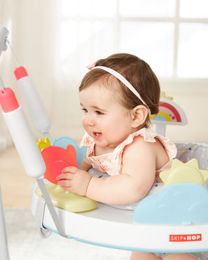 Baby reaching the clip-on toys on the Skip Hop jumper