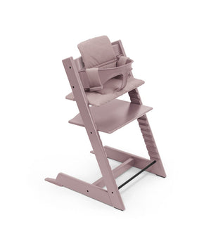 Stokke Tripp Trapp Classic Cushion in Heather Mauve shown on a chair with the Heather Mauve Baby Set