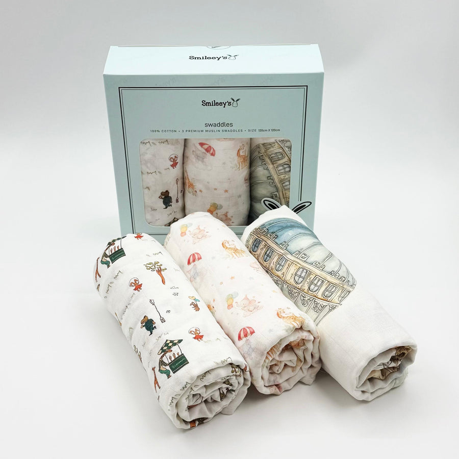 Smileey's 3-pack premium cotton muslin swaddles, 120cm x 120cm, in a mint Smileey's gift box with three watercolour prints