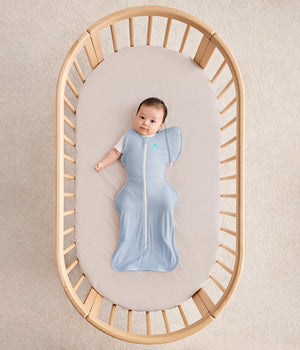 Baby in cot wearing Transition Bag 0.2 TOG Cotton Soft Blue