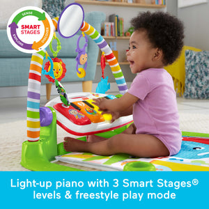 Baby sitting up and playing the light-up piano with 3 Smart Stages levels