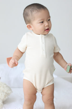 Baby wearing Twinkle Planet Purely Natural bodysuit