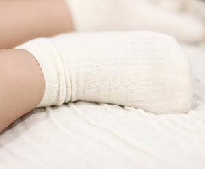 Baby wearing Twinkle Planet organic cotton socks