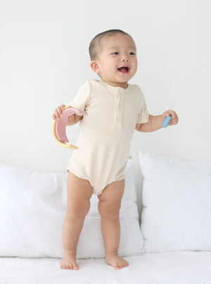Baby wearing Twinkle Planet Purely Natural bodysuit, worn view