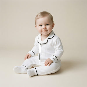 Baby wearing the Count & Countess Classic White Pima romper sleepsuit