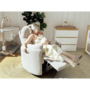 Parent feeding a baby in the Babyhood Firenza chair in Latte