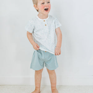 Faux button detail on Kays+Kins Stone Blue Bermuda shorts
