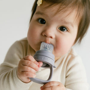 BIBS Baby Feeder Fossil Grey in use