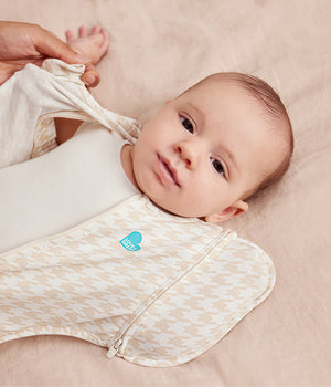 Baby with one wing removed in Transition Bag 1.0 TOG Tan Houndstooth
