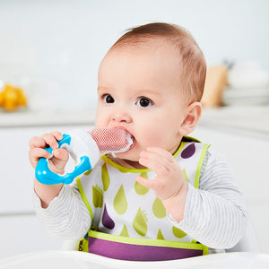Baby using the b.box Fresh Food Feeder in Blueberry