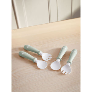 BabyBjörn Baby Spoon and Fork, 4 pcs, Powder Green on a table