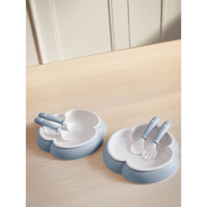 BabyBjörn Baby Plate, Spoon and Fork, 2 sets, Powder Blue on a table