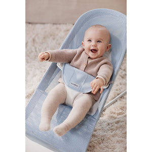 Baby resting in the BabyBjörn Bouncer Balance Soft in pearly sky blue and white mesh