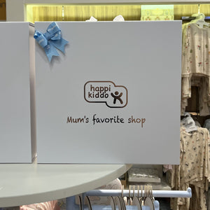 Happikiddo gift box with blue ribbon on display in store