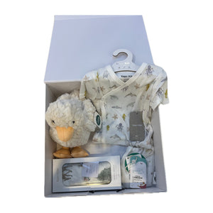 The Newborn Welcome Gift Luxe — gift box opened showing the pieces inside