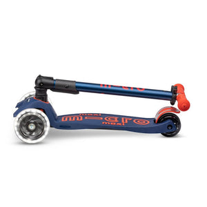 Micro Maxi Deluxe Foldable LED scooter in Navy Red, shown folded